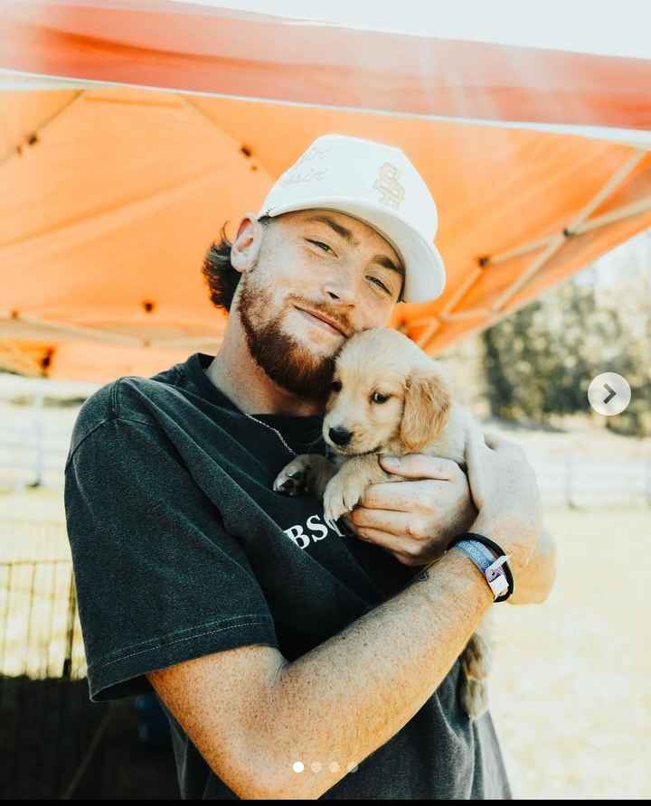 Image - Bailey Zimmerman in a cute lil' photo with his pet dog, Pie. 