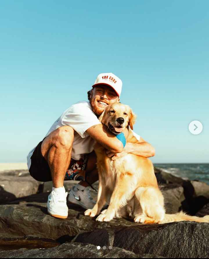 Image - Bailey Zimmerman in a cute lil' photo with his pet dog, Marley. 